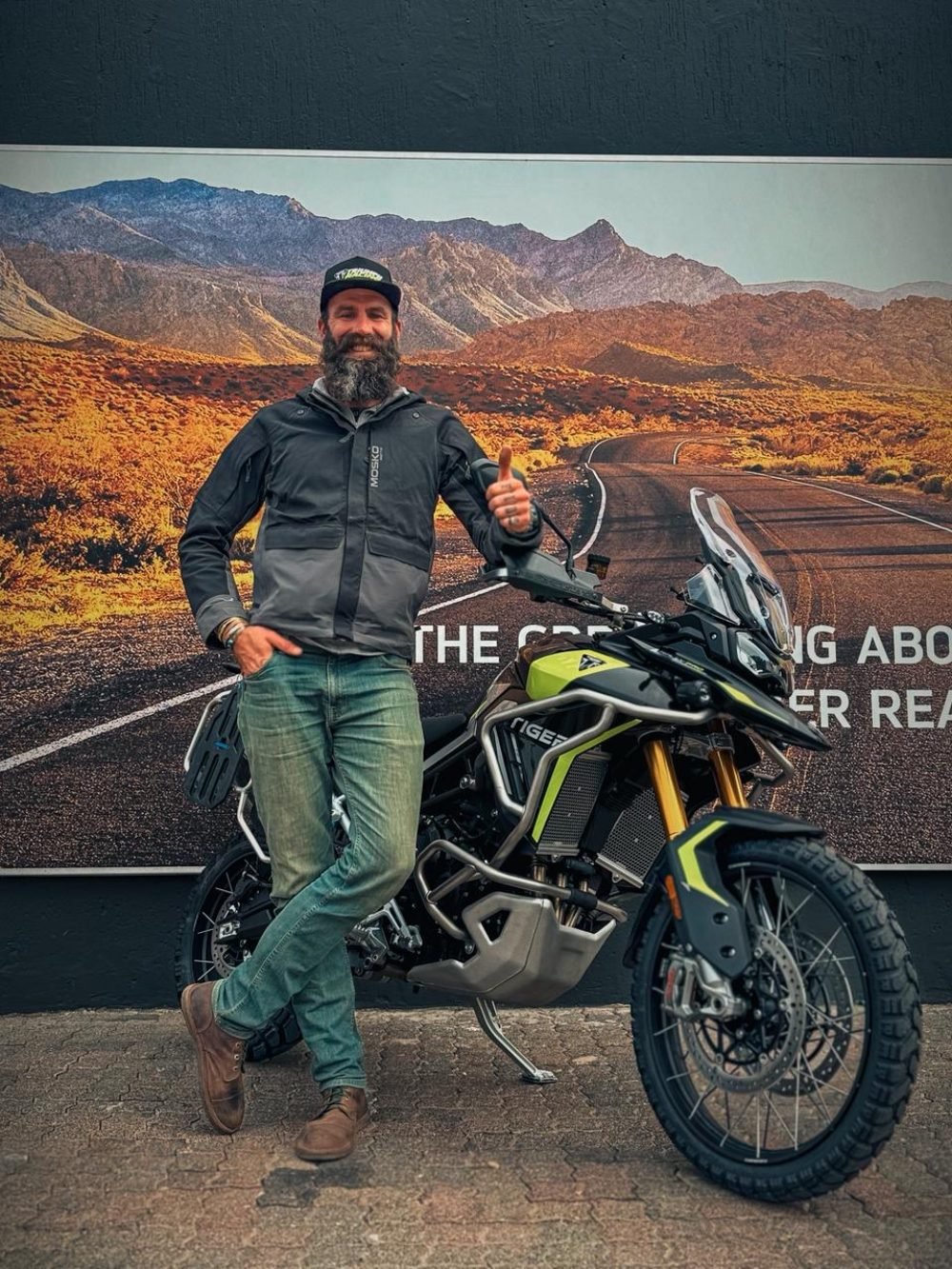 Off-road motorcycle stuck in muddy Lesotho track near Molotonyani Waterfall
