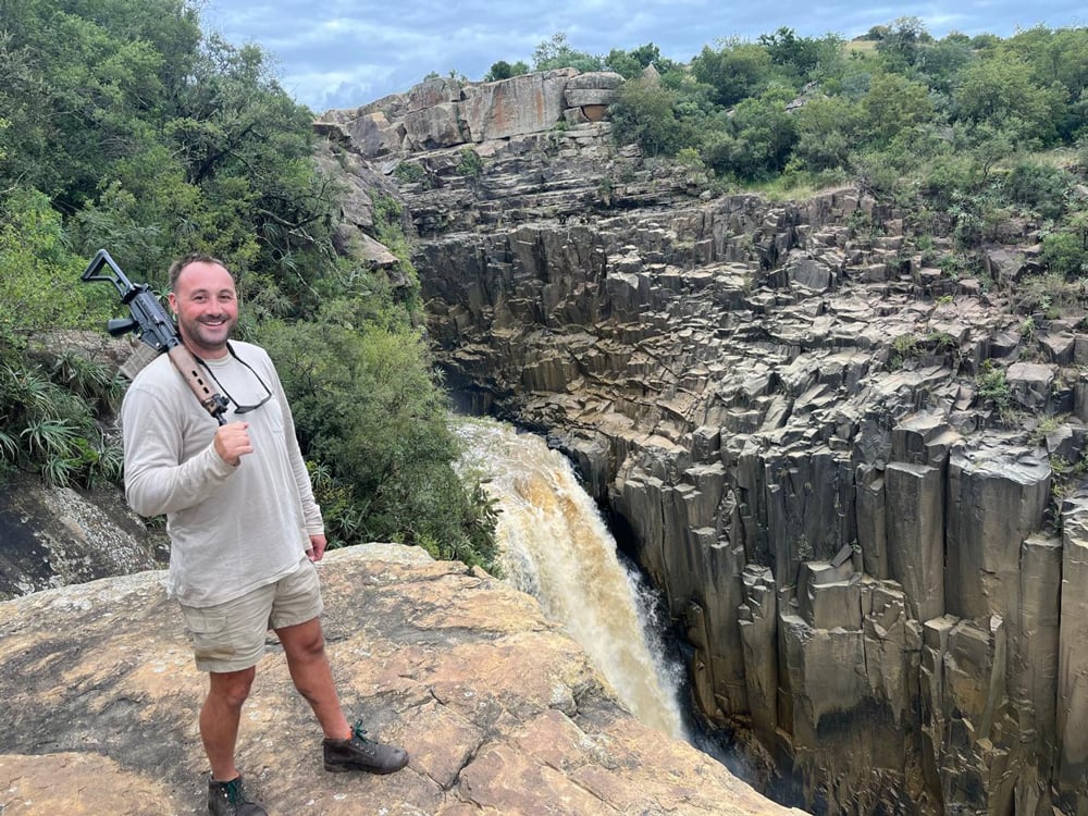 Kyle Preston, Nambiti Anti-Poaching Manager overlooking a gorge